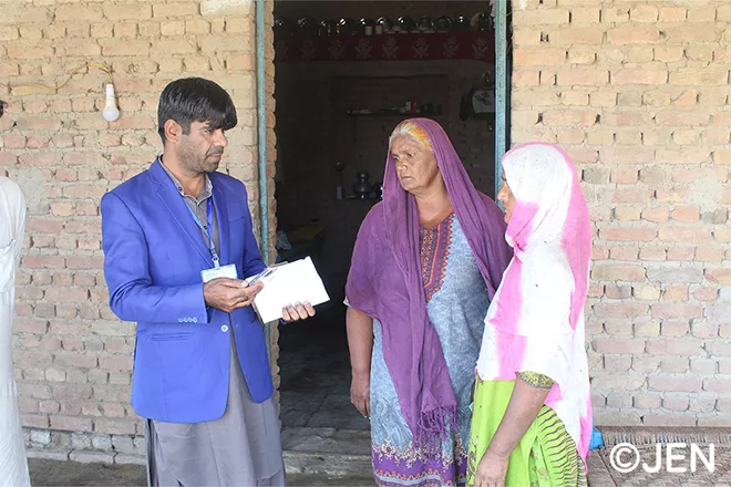 JEN staff interviewing village residents